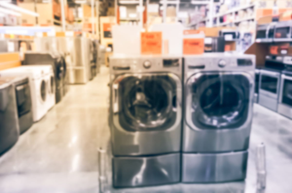 A warehousing store with a group of washing machines.