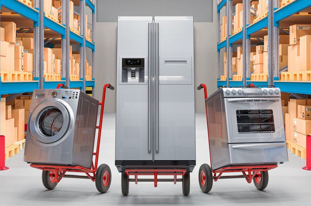 Two refrigerators and a washing machine on a cart in a warehousing facility.